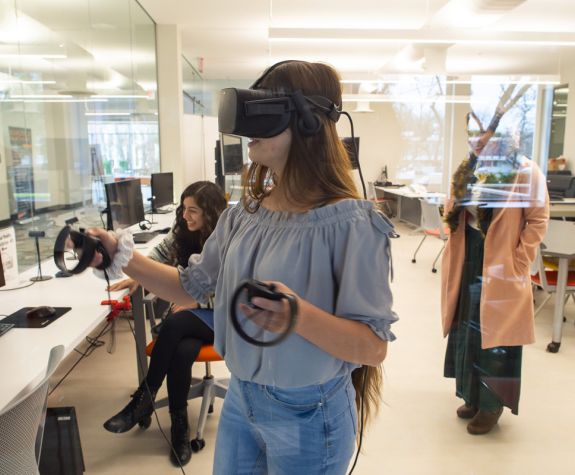 Student using virtual reality headset in the Cube